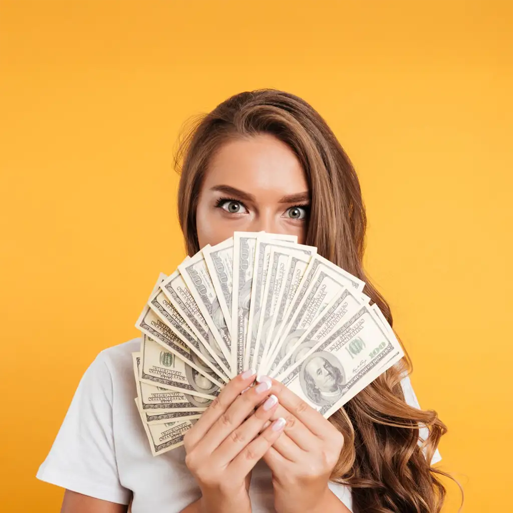 Woman with cash in hand. Sell your gold to Cash 4 Gold in Red Bank, NJ.